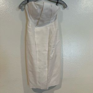Bebe white strapless evening dress with zipper at the back all the way down.